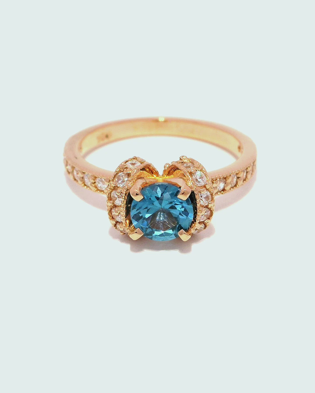 Anillo de oro rosa 18k ley con diamante azul